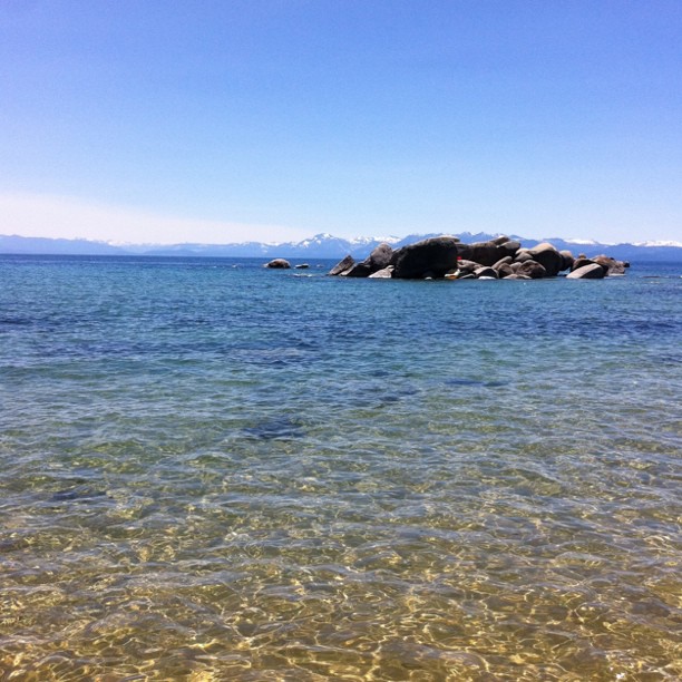 Crystal clear water and snow capped peaks in the background at South Lake Tahoe (Taken with instagram)