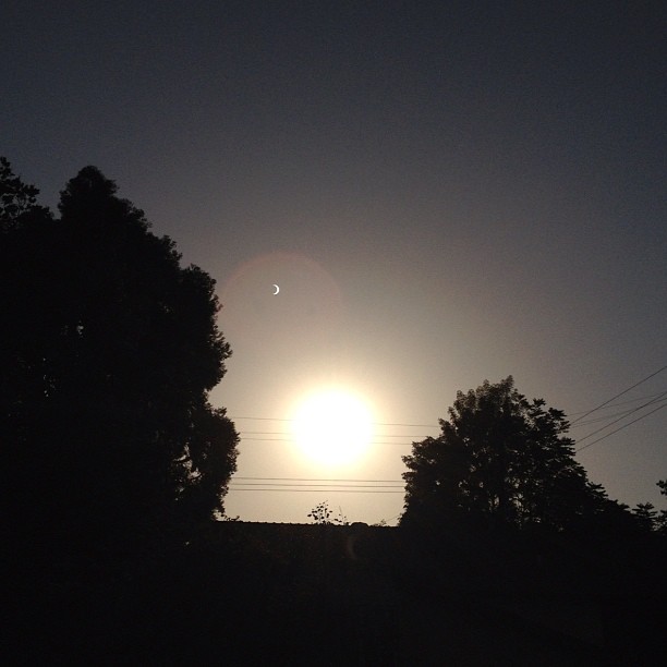 This is a partial solar eclipse. Look at the lens flare and you&#8217;ll see it.  (Taken with instagram)