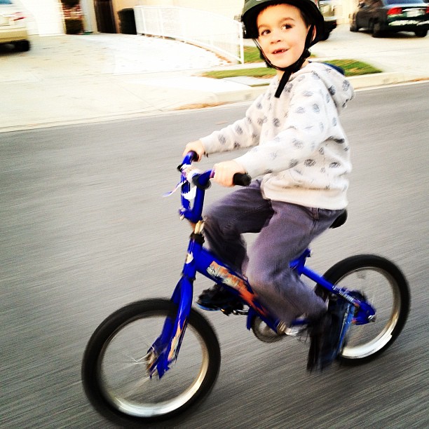 Jack speeding along. I took this today while spending some one-on-one time with him on an adventure of his choosing. I love that smile! (Taken with instagram)