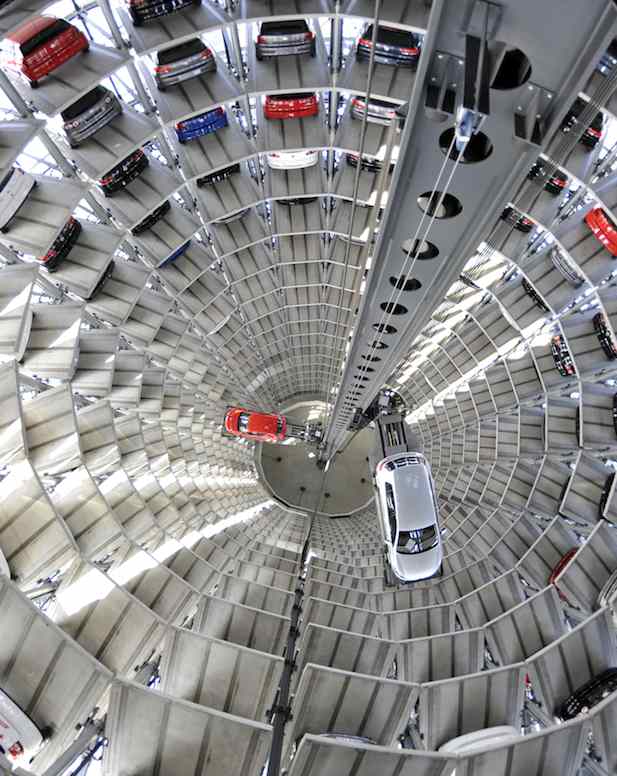 I want one. The garage, not the car.
peetypassion:

Photo You Must See: Vertical Volkswagens at Germany’s Autostadt
Volkswagen Golfs are stacked in one of the massive glass silos at Autostadt,  the theme park adjacent to Volkswagen’s main plant in W…